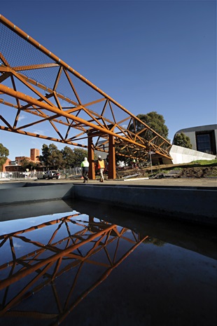 Deakin University Burwood pedestrian bridge uses BlueScope REDCOR® weathering steel to deliver a practical, paint-free structure requiring minimal maintenance compared with conventional structural steel